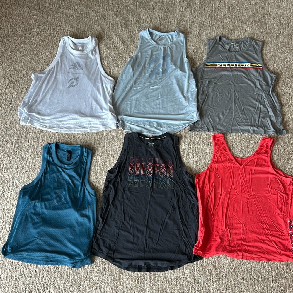 All medium Peloton branded tank tops